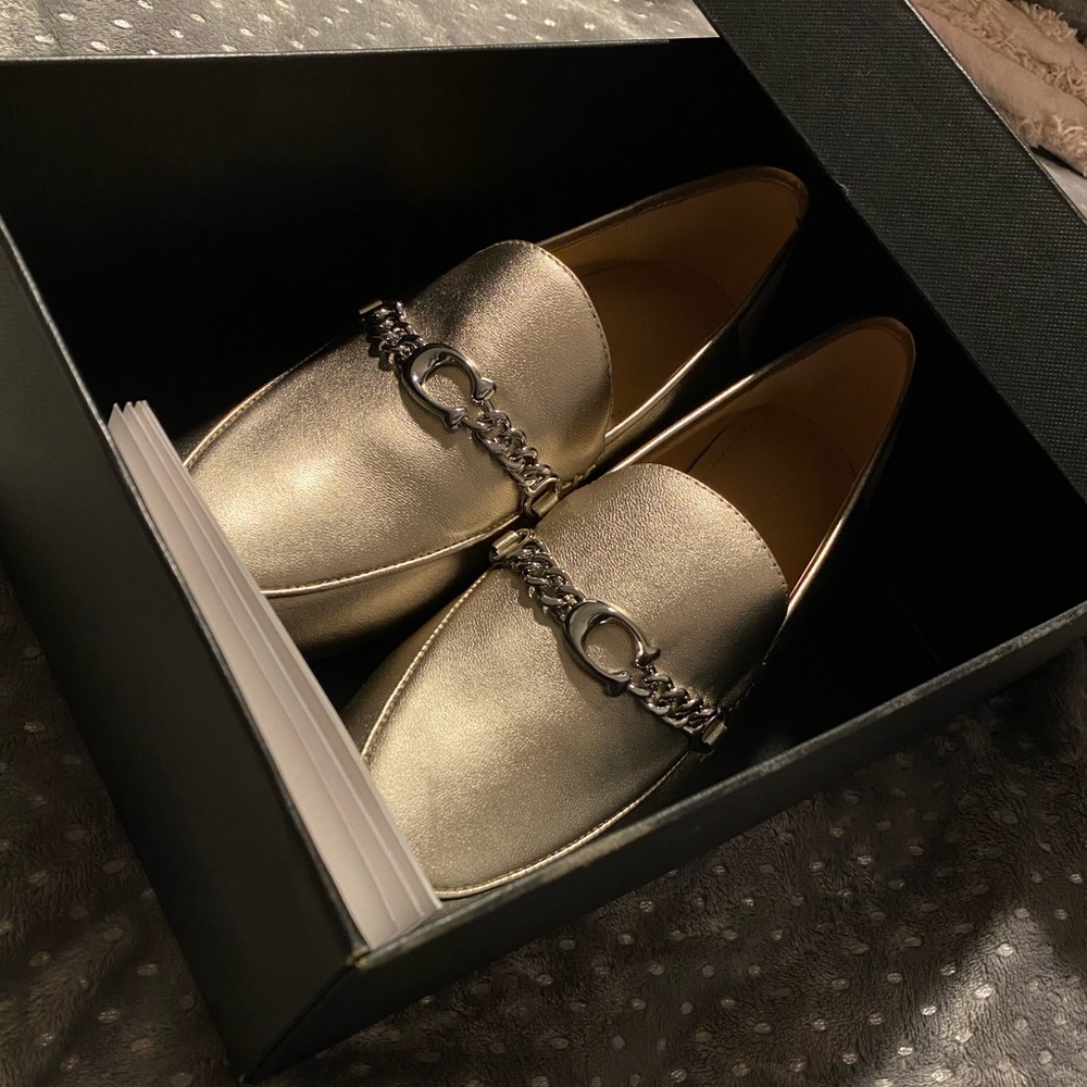 •platinum champagne Coach loafers•